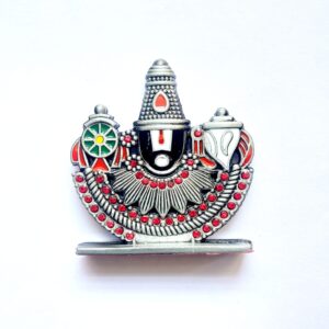 hand holding gada idol car dashboard (copy)